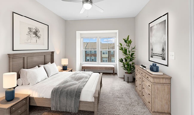 carpeted bedroom with ceiling fan and light fixture